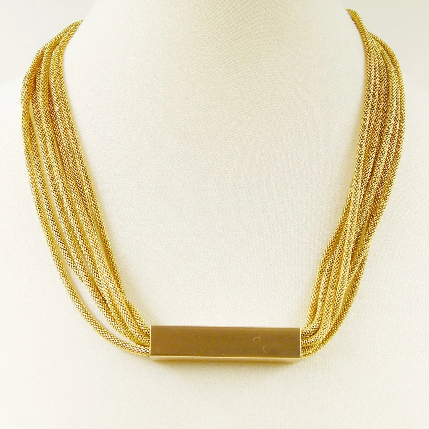 Chunky multi strand chain necklace with metal bar pendant