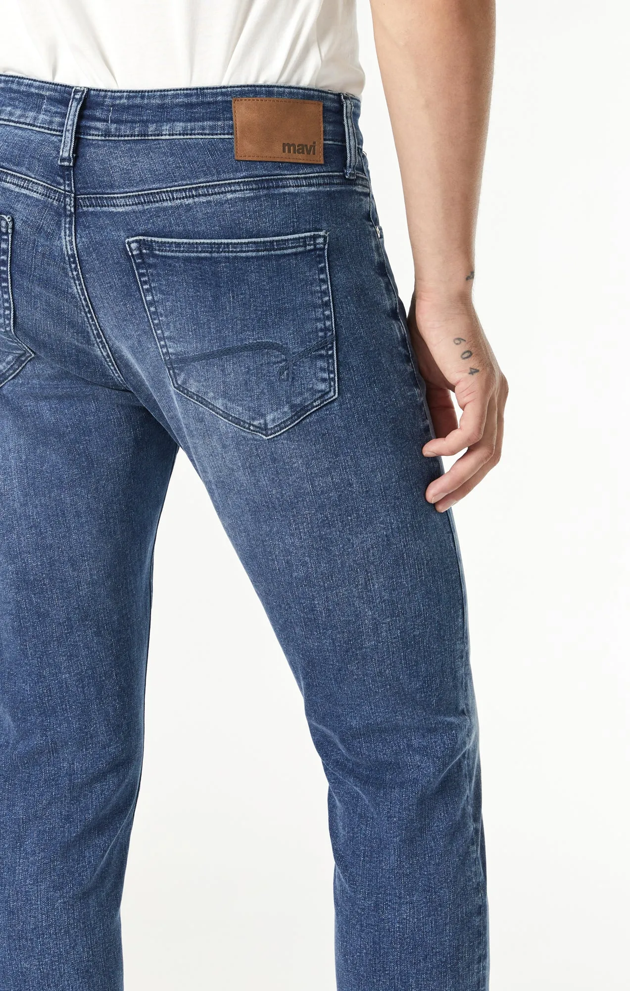JAKE SLIM LEG IN MID FEATHER BLUE