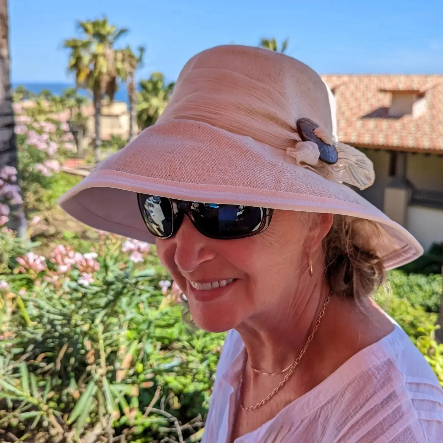 Stylish Extra wide brim sunblocker in cotton/flax and winter white canvas with shell buckle and textured scarf