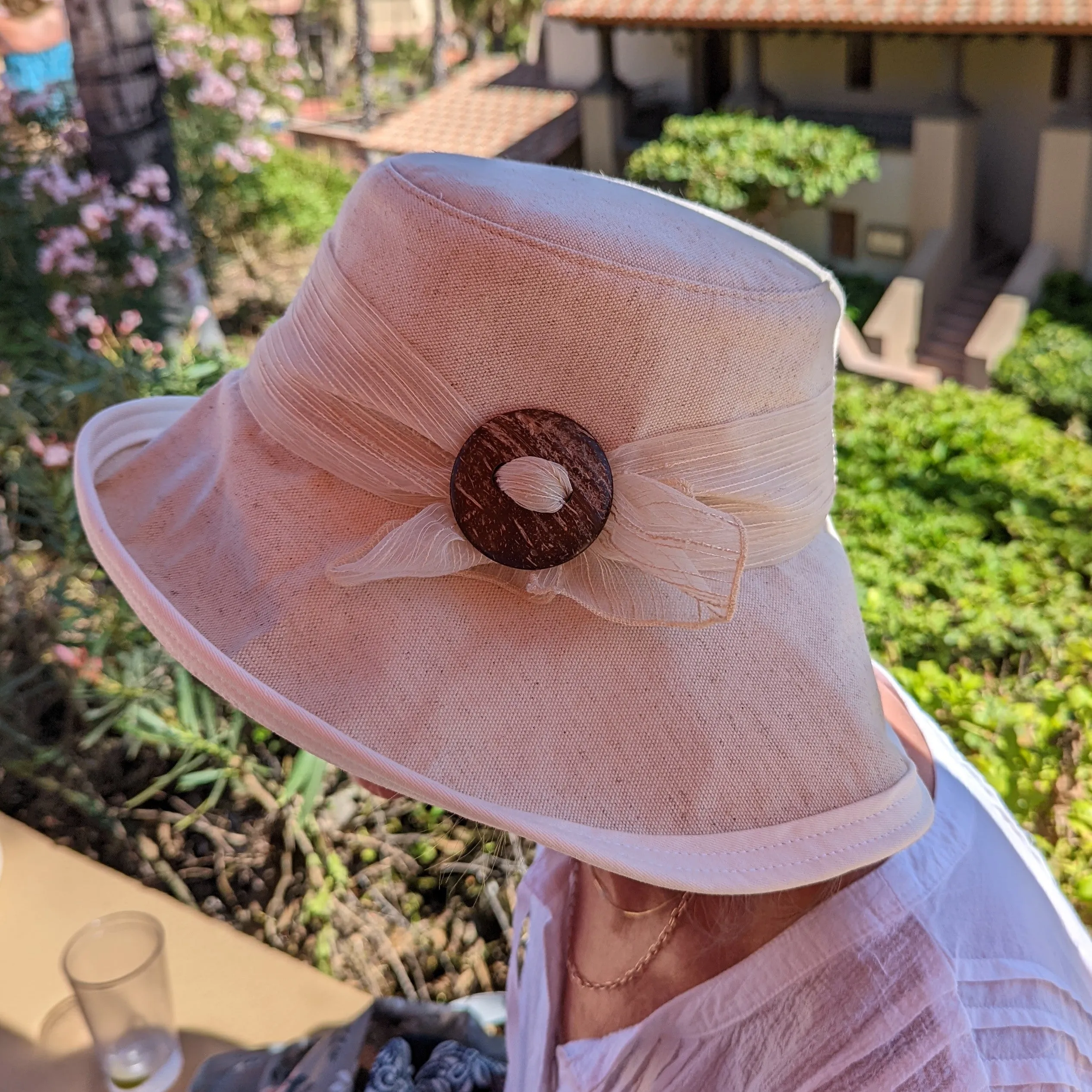 Stylish Extra wide brim sunblocker in cotton/flax and winter white canvas with shell buckle and textured scarf